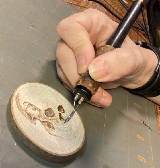 Wood-burning wood slice with skull image